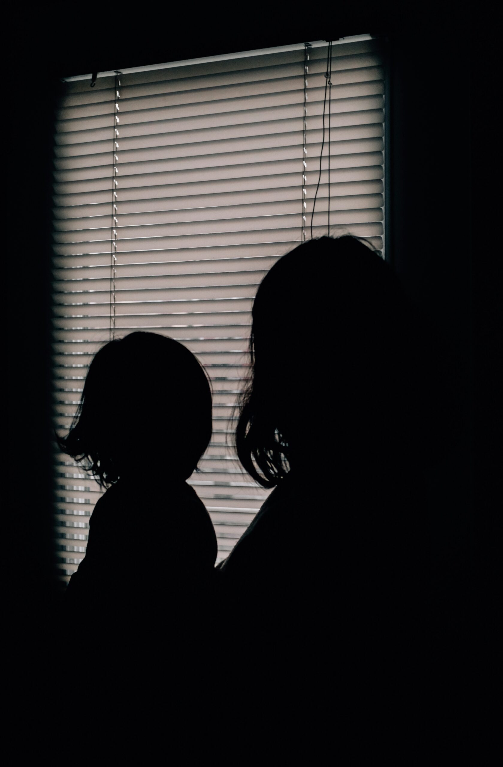 Mother and child in silhouette. Legal vs physical custody in Ocean County.