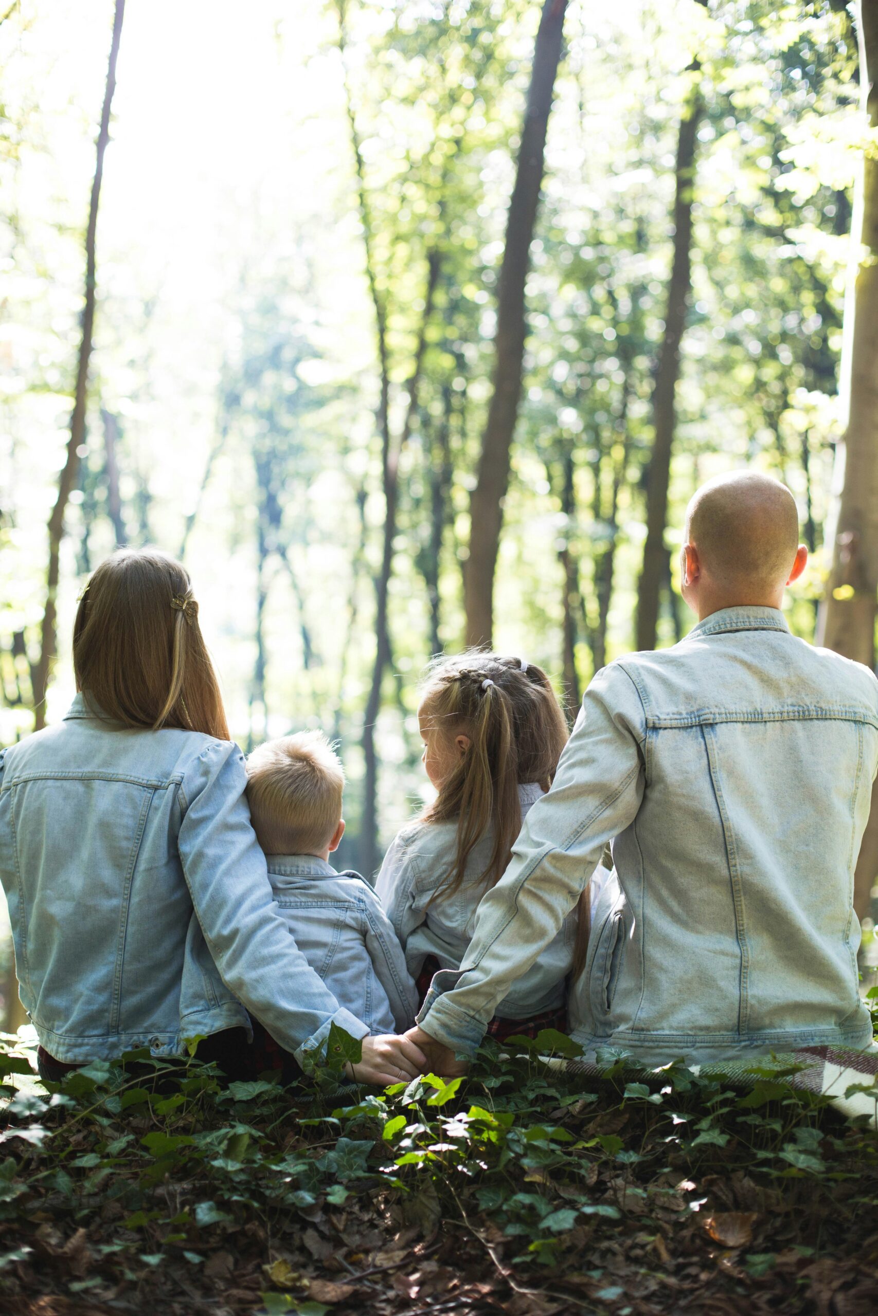 Family looking out in the forest. Stepparent adoption in Ocean County.