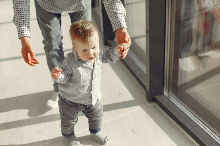 Toddler learning to walk, representing early childhood needs considered in a parenting plan in New Jersey.